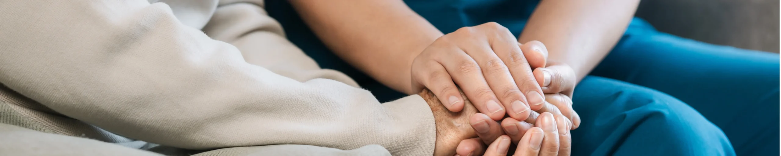 clinician holding patient's hand