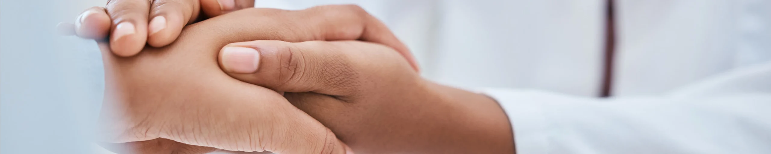 clinician holding patient's hand