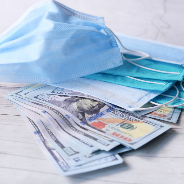 surgical mask and hundred dollar bills